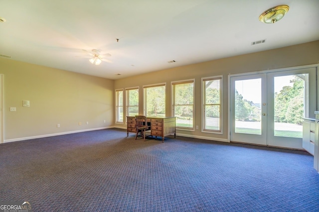 interior space with dark colored carpet, french doors, and ceiling fan