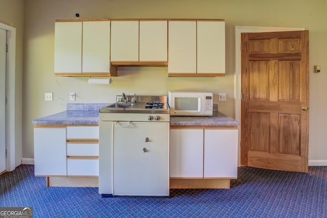 kitchen featuring white cabinetry