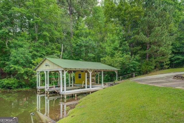 dock area featuring a yard and a water view