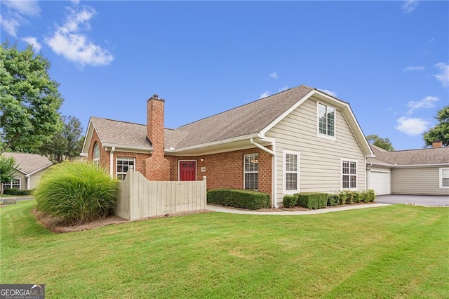 view of home's exterior featuring a yard and a garage