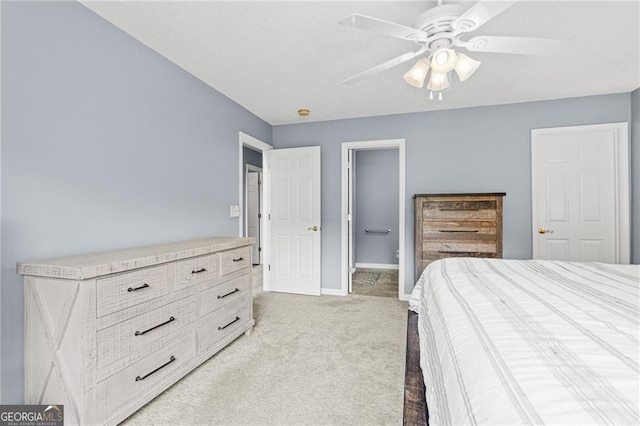 bedroom with light colored carpet and ceiling fan