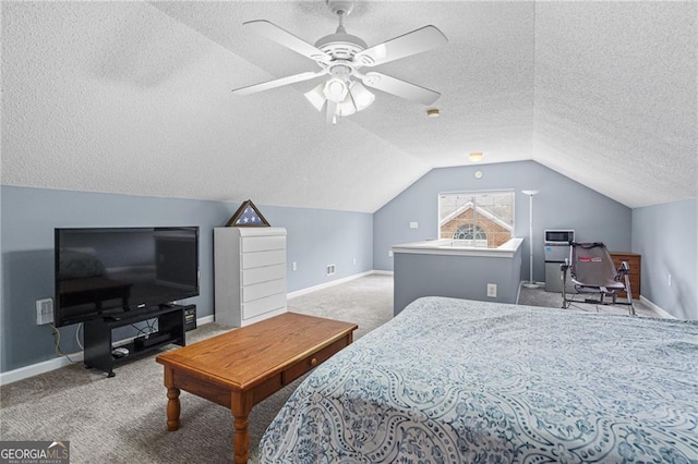 bedroom featuring a textured ceiling, ceiling fan, carpet floors, and vaulted ceiling