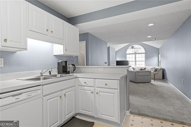 kitchen with sink, kitchen peninsula, white dishwasher, light colored carpet, and white cabinets