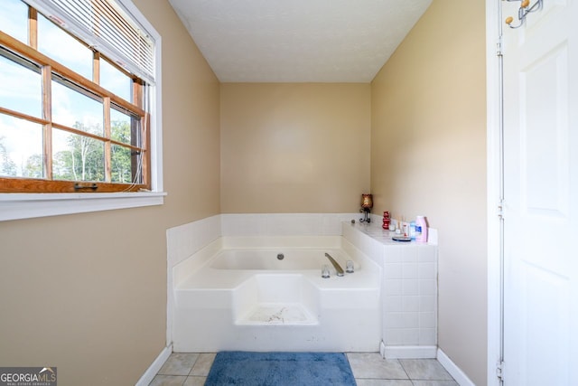 bathroom featuring a bathtub and tile patterned floors