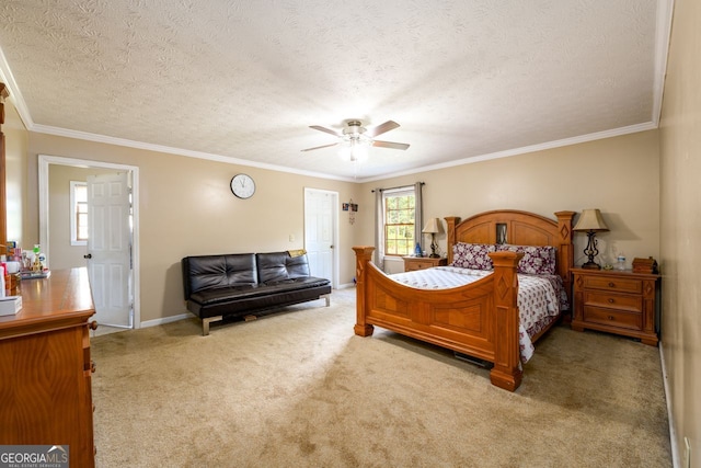 bedroom with light carpet, ceiling fan, a textured ceiling, and crown molding