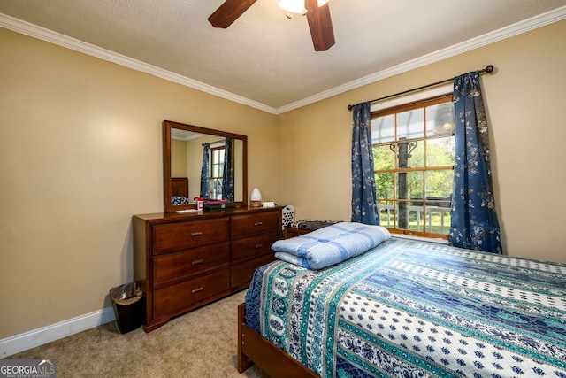 bedroom with ceiling fan, light carpet, and crown molding