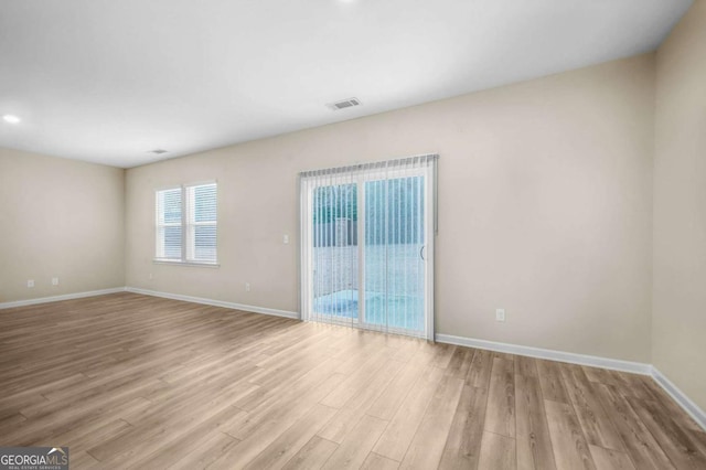 empty room featuring light hardwood / wood-style floors