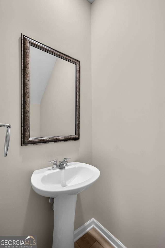 bathroom featuring wood-type flooring