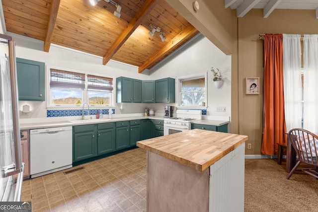 kitchen with white appliances, sink, lofted ceiling with beams, wooden ceiling, and butcher block counters