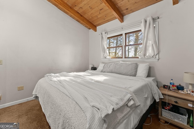 carpeted bedroom featuring lofted ceiling with beams and wood ceiling