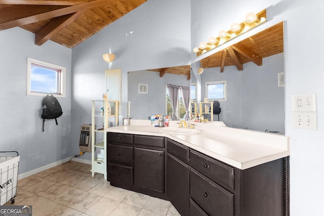 bathroom with beamed ceiling, plenty of natural light, and wooden ceiling