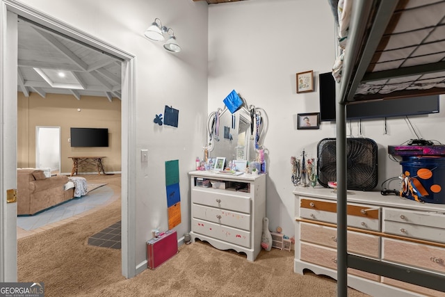 interior space featuring beam ceiling, light carpet, and coffered ceiling