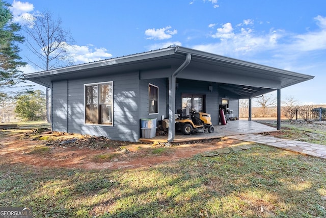 rear view of house with a carport