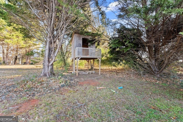 view of yard featuring a wooden deck