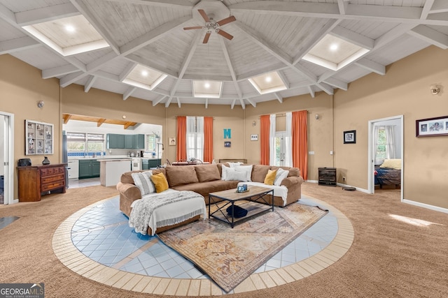 carpeted living room featuring ceiling fan