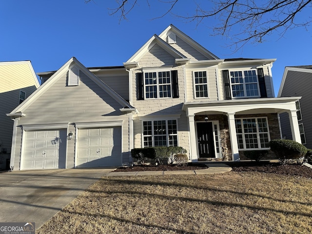 681 Courageous Ct, Lawrenceville, GA 30043 - traditional home with driveway, a garage, and covered porch