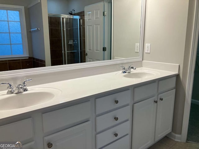 681 Courageous Ct, Lawrenceville, GA 30043 - bathroom with double vanity, a shower stall, and tile patterned flooring