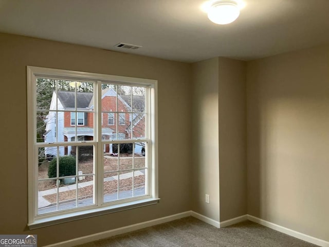 681 Courageous Ct, Lawrenceville, GA 30043 - carpeted empty room with baseboards