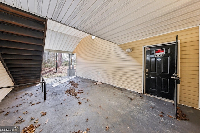 property entrance with a carport