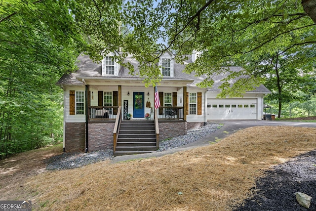 new england style home featuring a porch and a garage