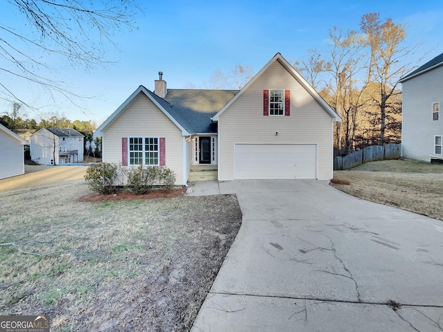 view of front of house featuring a front lawn and a garage