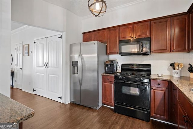 kitchen featuring light stone countertops, black appliances, dark hardwood / wood-style floors, and ornamental molding