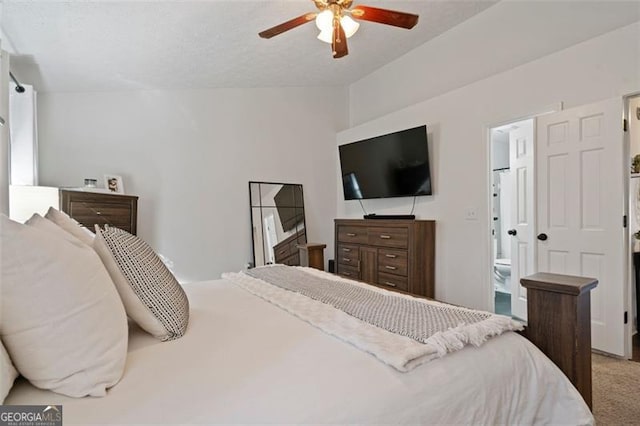 carpeted bedroom featuring ensuite bathroom and ceiling fan