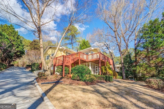 view of front of home featuring a wooden deck and stairs