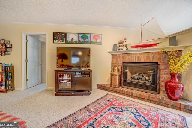 carpeted living area with a fireplace, crown molding, and a textured ceiling