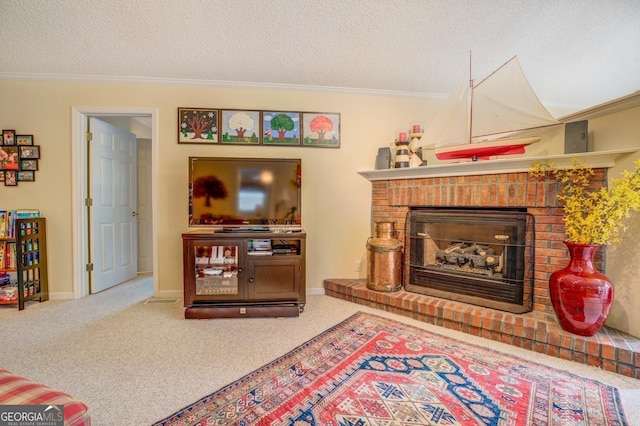 carpeted living area featuring baseboards, a fireplace, a textured ceiling, and crown molding