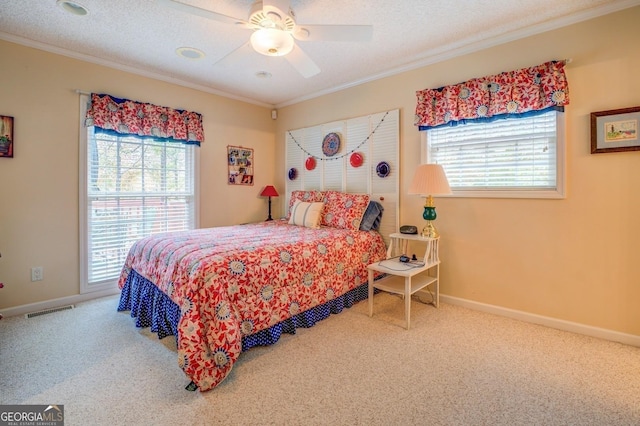 carpeted bedroom with crown molding, a textured ceiling, and baseboards