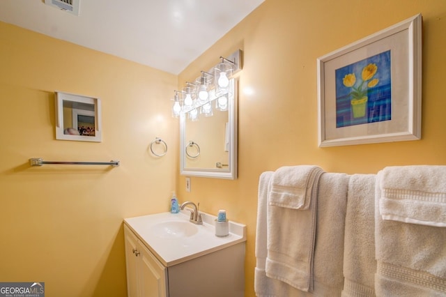 bathroom with visible vents and vanity