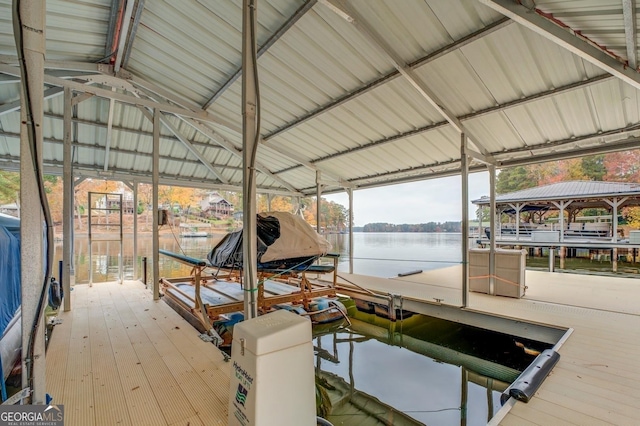 dock area with a water view and boat lift