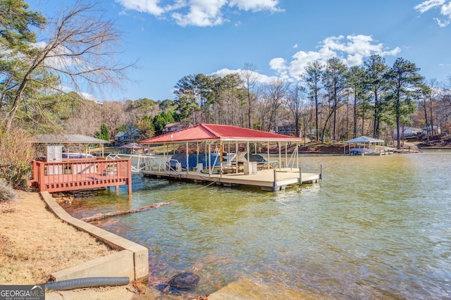 view of dock featuring boat lift and a water view