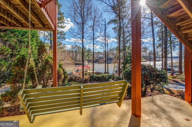 view of patio with a water view