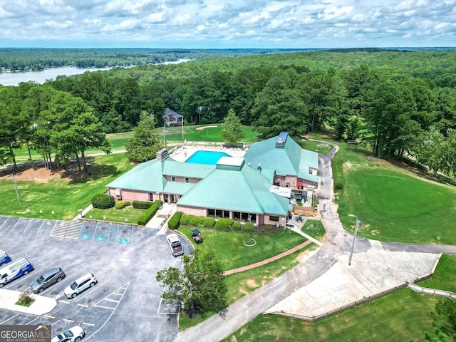 aerial view with a water view and a view of trees