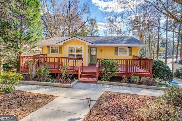 single story home featuring a deck