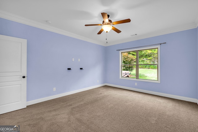 empty room with carpet flooring, ceiling fan, and crown molding