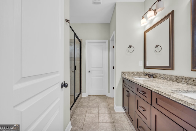 bathroom with vanity, tile patterned floors, and an enclosed shower