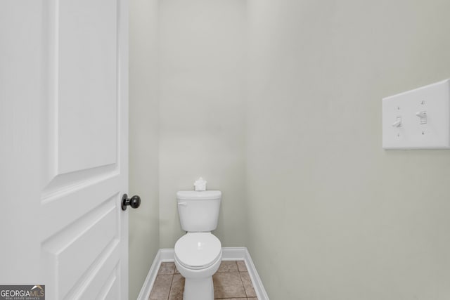 bathroom featuring tile patterned flooring and toilet