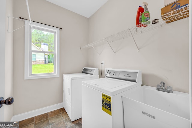 laundry room with washer and dryer and sink