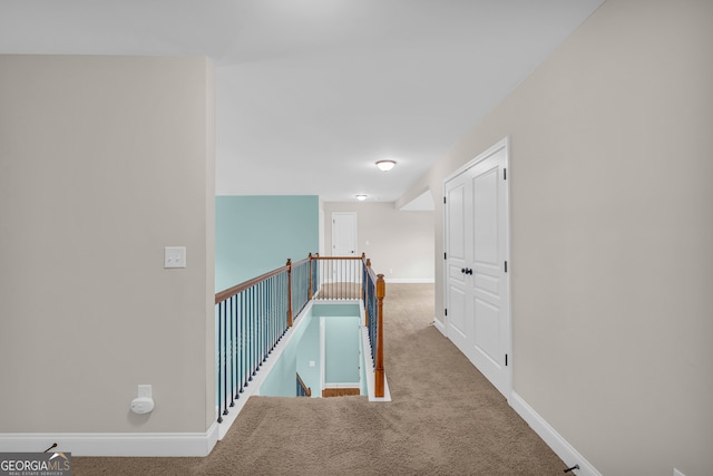 hallway featuring carpet flooring