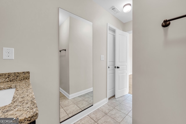 hallway with light tile patterned floors