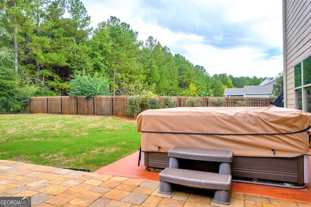 view of patio with grilling area and a hot tub