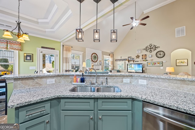 kitchen with crown molding, sink, stainless steel dishwasher, ceiling fan, and light stone counters