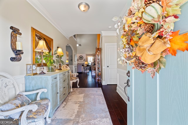 foyer with dark hardwood / wood-style flooring and crown molding