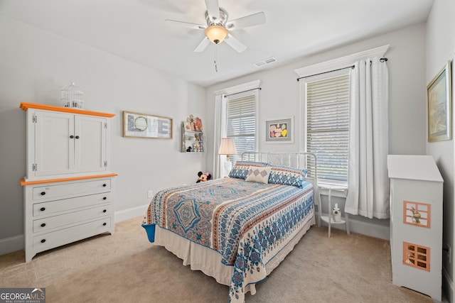 bedroom featuring ceiling fan and light carpet