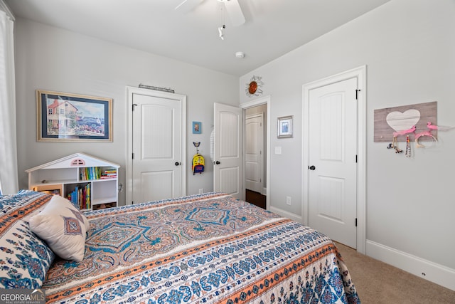 bedroom with ceiling fan and carpet floors