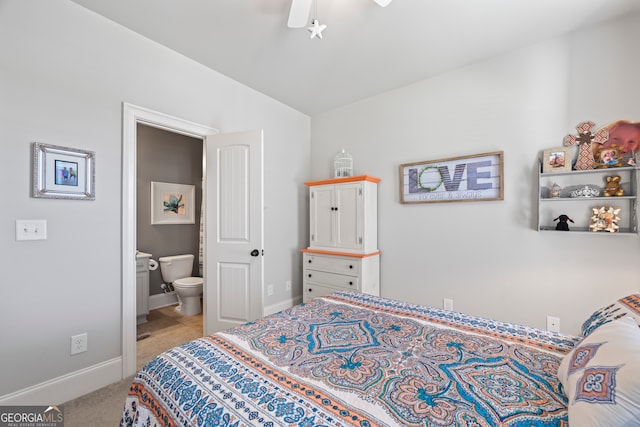 carpeted bedroom featuring connected bathroom and ceiling fan