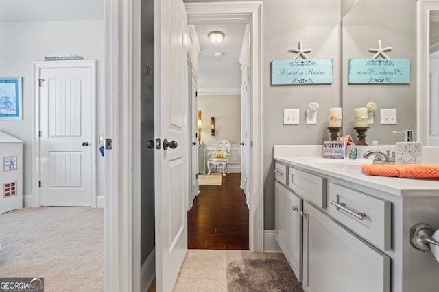 bathroom with vanity and crown molding